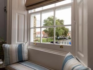 a window in a room with a couch and a pillow at Beverley Minster House in Beverley