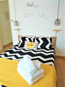 Cama o camas de una habitación en D Wan Guest House