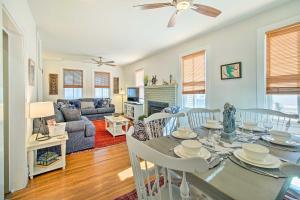 a dining room and living room with a table and chairs at North Beach Cottage - Walk to Chesapeake Bay in North Beach