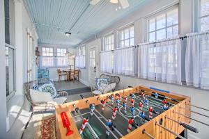 a room with a foosball table in the middle at North Beach Cottage - Walk to Chesapeake Bay in North Beach