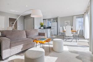 a living room with a couch and a table at Pier View Suites - Townhouse A in Cayucos