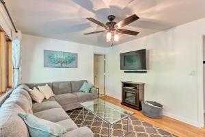 a living room with a couch and a fireplace at Harpers Ferry Cabin - Walk to Private Lake! in Harpers Ferry