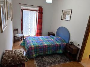 A bed or beds in a room at IL RUSTICO UNO a Bugnara nella Valle del Sagittario