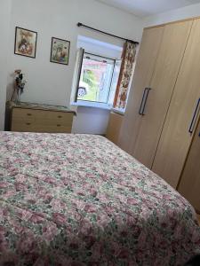 A bed or beds in a room at IL RUSTICO UNO a Bugnara nella Valle del Sagittario