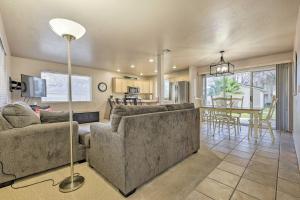 a living room with a couch and a table at Beautiful St George Condo about 5 Mi to Downtown! in St. George
