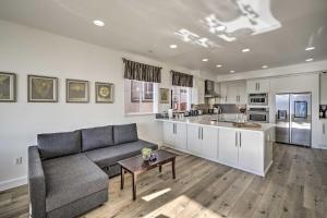 a living room with a couch and a kitchen at San Francisco Getaway with Luxury Amenities! in South San Francisco