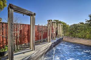 an outdoor deck with a fence and a pool at San Francisco Getaway with Luxury Amenities! in South San Francisco