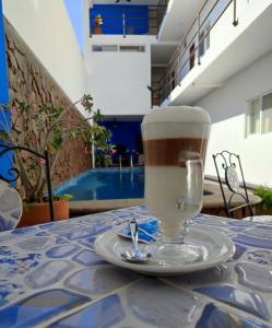a cup of coffee sitting on a table at blue BOCANA in Santa Cruz Huatulco