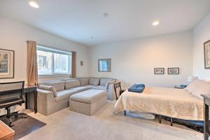 a bedroom with a bed and a couch and a piano at Modern Townhome, Day Trip to Colorado Ski Resorts! in Louisville