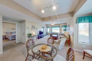 a living room with a table and chairs at Tidewater Retreat in North Myrtle Beach