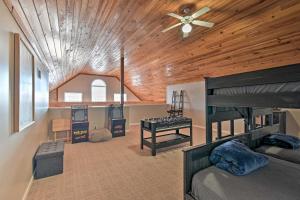 a bedroom with bunk beds and a wooden ceiling at Lakefront Retreat with Views, Near Mammoth Cave! in Cub Run