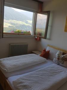 Postel nebo postele na pokoji v ubytování Ferienhaus Panorama
