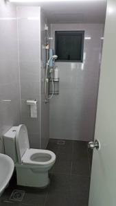 a bathroom with a toilet and a sink at Vista Alam Studio in Shah Alam