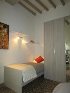 Ένα ή περισσότερα κρεβάτια σε δωμάτιο στο I GIOIELLI DI PERUGIA - palazzo 1 - VIA DELIZIOSA - alloggi e camere in centro storico