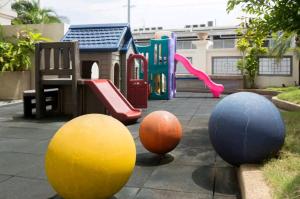 a playground with different types of play equipment at WestParc Cedar Alabang in Manila