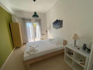 Postel nebo postele na pokoji v ubytování Nefeli Β1 apartment