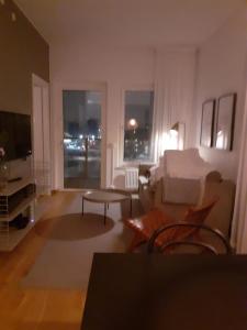 a living room with a couch and a table at Two room Apartment in Sundbyberg Stockholm in Sundbyberg