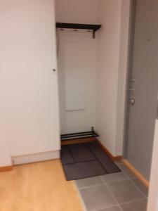an empty room with a door and a floor at Two room Apartment in Sundbyberg Stockholm in Sundbyberg