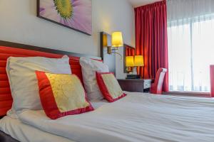 Postel nebo postele na pokoji v ubytování Hotel Allure