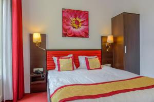 Postel nebo postele na pokoji v ubytování Hotel Allure