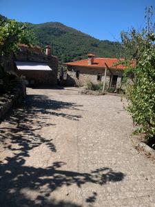 an empty driveway in front of a house at Casa da Horta - Douro Portugal in Bafueiras
