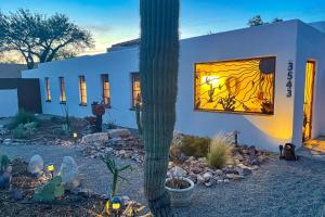 a house with a window with a cactus in front of it at The Urban Ranch in Tucson