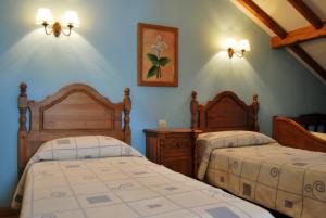 Tempat tidur dalam kamar di La Becada de Buelna