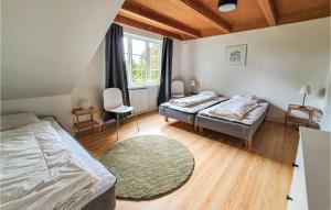 A bed or beds in a room at Amazing Home In Agunnaryd With Wifi