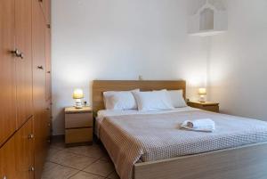 Postel nebo postele na pokoji v ubytování Villa Apostolis