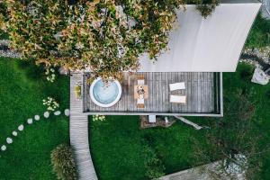 an overhead view of a garden with a swimming pool at Luxury vineyard resort Chateau Ramšak in Maribor