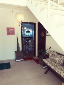 Μια τηλεόραση ή/και κέντρο ψυχαγωγίας στο Apartamento Praia do Santinho nº103