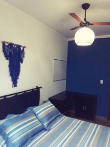 Ένα ή περισσότερα κρεβάτια σε δωμάτιο στο Apartamento Praia do Santinho nº103