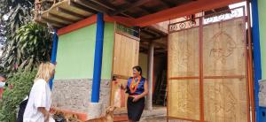 two women standing outside of a building at POSADA KAUAI in Mocoa