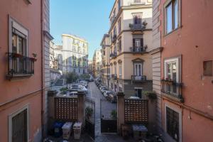 a view of a street with parked cars in a city at Salvanna Centro Storico in Naples