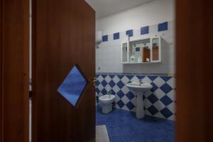 a bathroom with a toilet and a sink at Salvanna Centro Storico in Naples +28 photos