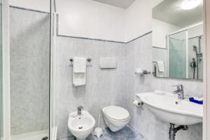 a bathroom with a sink and a toilet and a shower at ASSO RESIDENCE STAZIONE in Terni