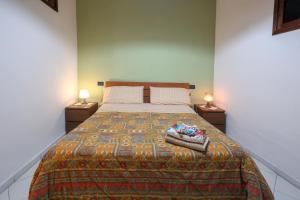 a bedroom with a large bed with two night stands at Salvanna Centro Storico in Naples