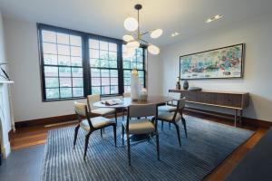 a dining room with a table and chairs at E10-3 3BR Designer Townhouse in New York