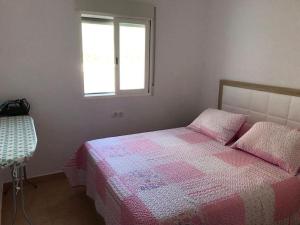 Cama o camas de una habitación en villa esperanza