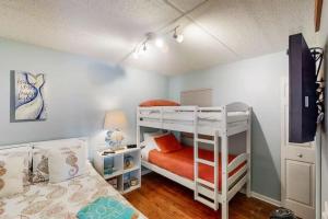 a bedroom with two bunk beds in a room at 3118 Near Ocean 1st Floor SE in Saint Augustine Beach