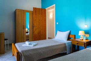 Postel nebo postele na pokoji v ubytování Villa Apostolis