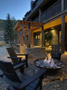 a fire pit and chairs in front of a house at Vaquera House in Crested Butte