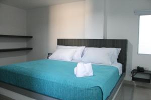 Uma cama ou camas num quarto em Hotel Onix T