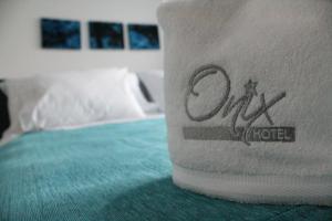 Uma cama ou camas num quarto em Hotel Onix T