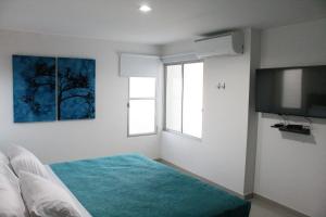 Uma cama ou camas num quarto em Hotel Onix T