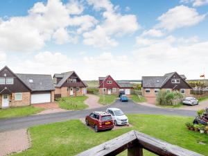 a view of a residential neighbourhood with houses at Dunes Court in Beadnell