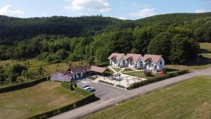 an aerial view of a house in the hills at Pallos Apartments in Sovata