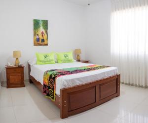 a bedroom with a large bed with at Hotel Country Boutique in Piura
