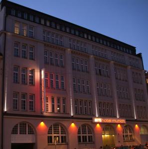a large building with a sign in front of it at Arthotel Munich in Munich
