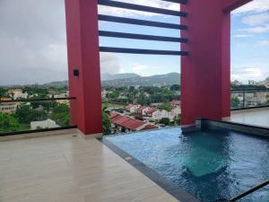 a swimming pool with a view of a city at Infinity Pool Paradise Vacation Home in Kingston